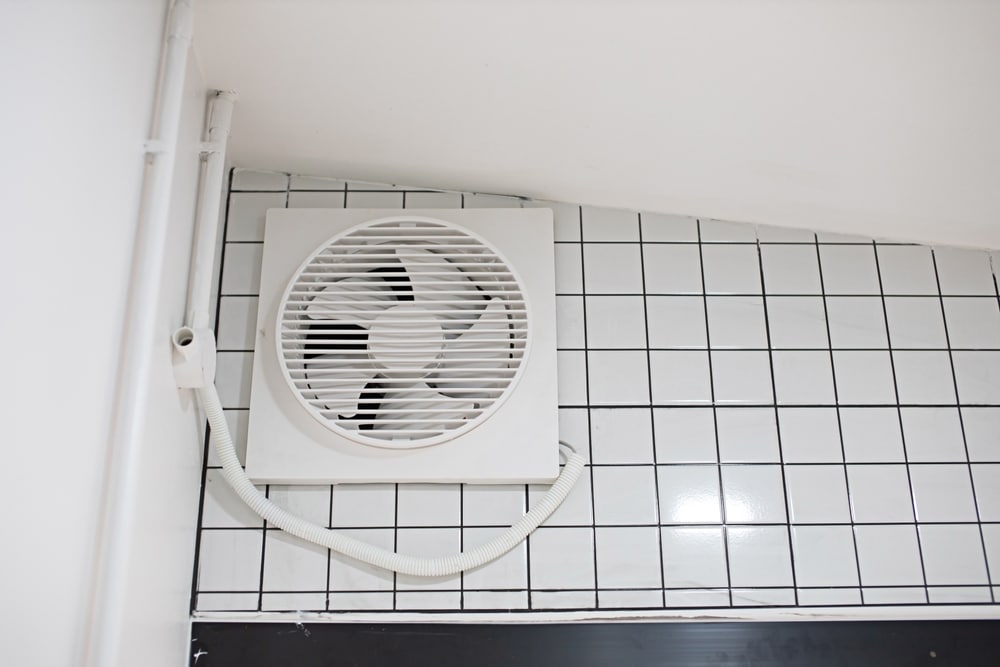 What does a bathroom extractor fan do?